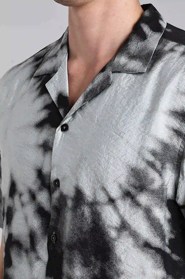 close up of a man wearing black tie dye shirt