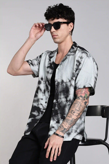 a man layering black tie dye shirt.
