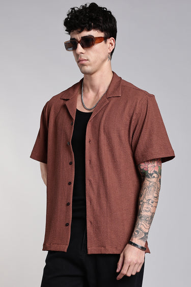 front profile of a man wearing the brown texture shirt