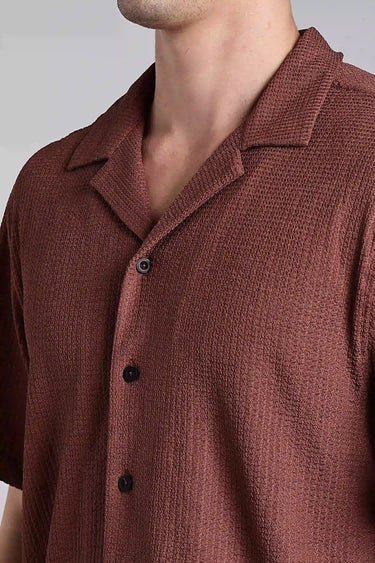 close up shot of brown textured shirt