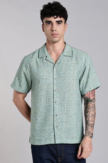 a man wearing sage green textured shirt - front view