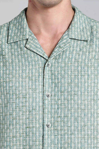 close up shot of the sage green textured shirt