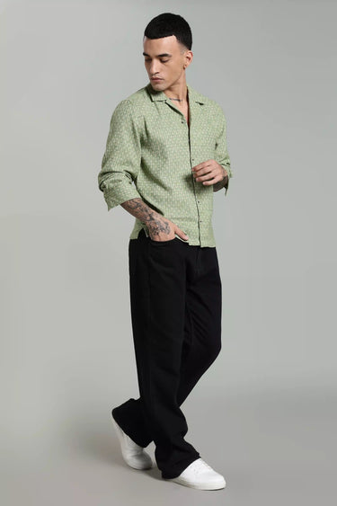 SIDE PROFILE OF A MAN WEARING THE GREEN JACQUARD FULL SLEEVE SHIRT FOR MEN