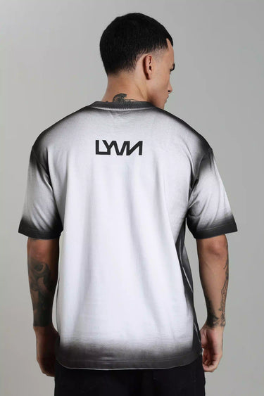 backview wearing a gradient unisex oversized t-shirt with 'LYVN' branding on the back against a gray background