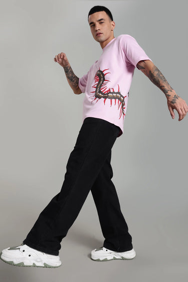 Side profile of a man wearing a pink oversized P.A.P. centipede t-shirt