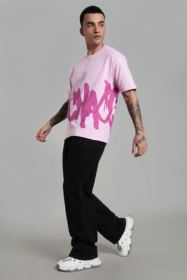 Side profile of a man wearing pink chaotic t-shirt