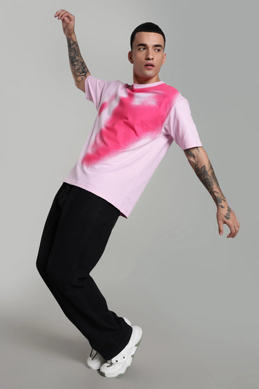 Side profile of a man wearing a pink abstract face t-shirt