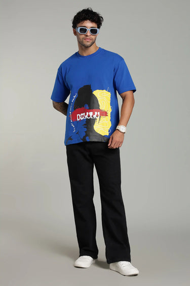 a man wearing BLUE DELULU OVERSIZED T-SHIRT