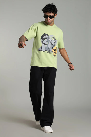A man wearing LIGHT GREEN DEAD END OVERSIZED T-SHIRT FOR MEN AND WOMEN on a plain background
