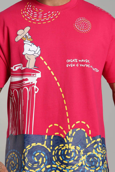 Pink oversized graphic t-shirt featuring a cartoon monster standing on a column with yellow waveforms and text detailing oversized fit. - LYVN