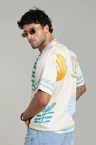 SIDE PROFILE OF A MAN WEARING OASIS PRINT SHIRT FOR MEN