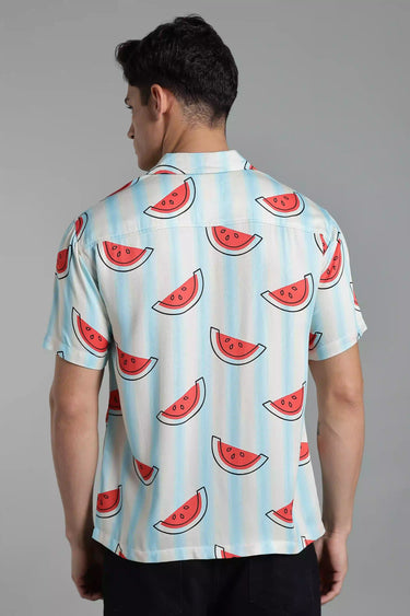back view of a man wearing a watermelon print shirt.