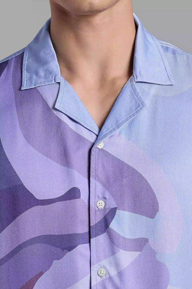 a man wearing ice cream cone print shirt