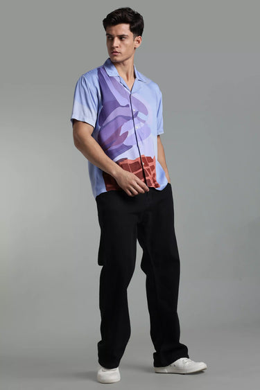 a man wearing ice cream cone print shirt