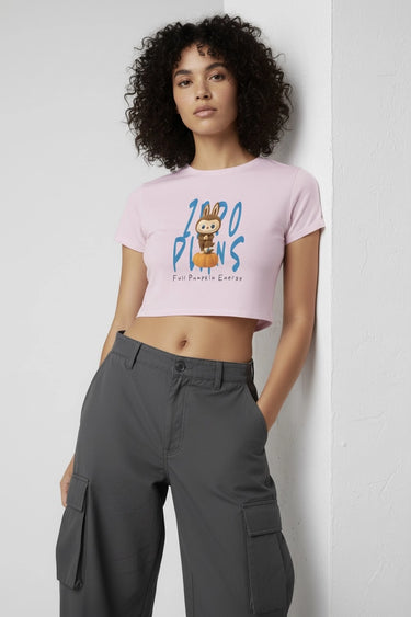 Pink graphic crop top with colorful monster print and short sleeves on model. - LYVN