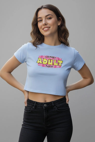 Light blue fitted graphic crop top with "I Cannot Adult Today" text in bold colorful fonts.