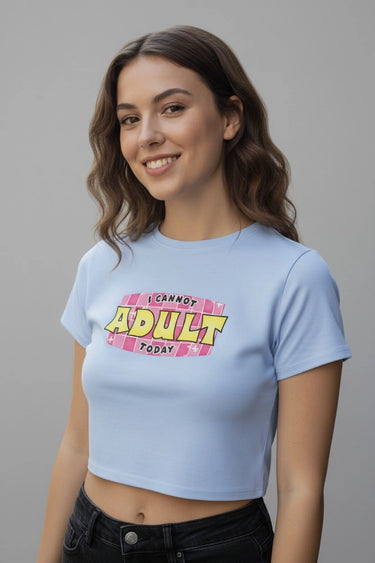 Light blue cotton graphic crop top with "I Cannot Adult Today" pink and yellow print.