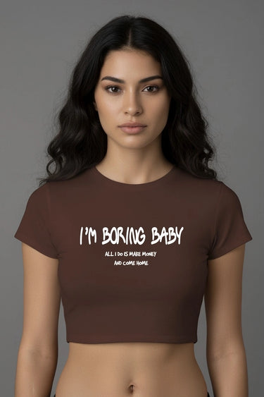 Brown graphic crop top with white "I'm Boring Baby" text and casual short sleeves.
