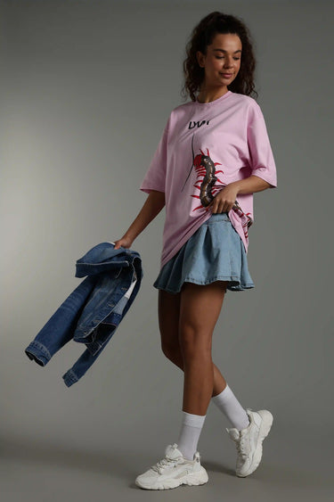 Side profile of a woman wearing pink P.A.P. centipede oversized t-shirt