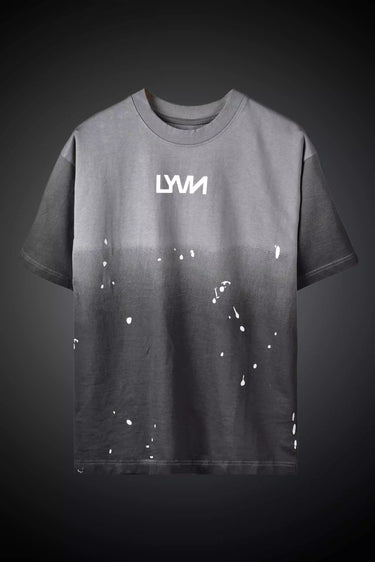 Gray t-shirt with white splatter design and 'LYVN' logo on a dark background- frontview