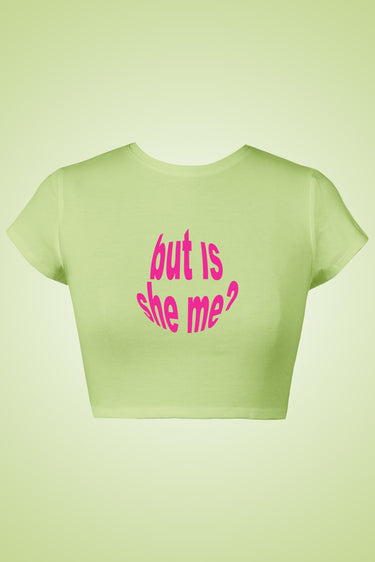 Light green graphic crop top with pink distorted text reading "but is she me?".