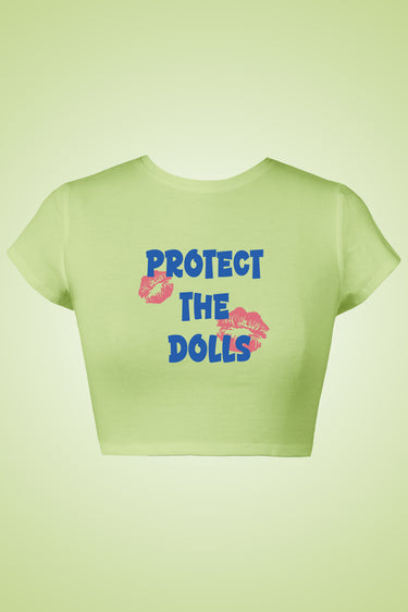 Light green graphic crop top with bold blue "Protect the Dolls" text and red lips print.