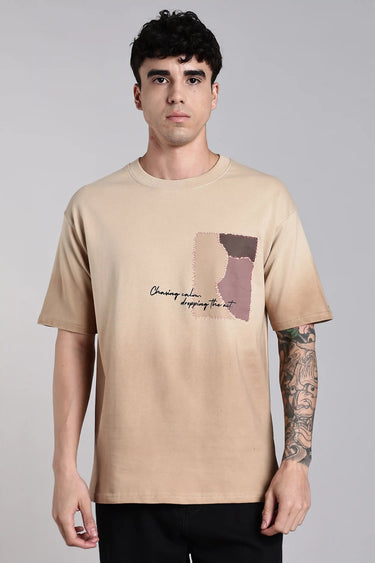 front view of a man wearing beige scar oversized t-shirt