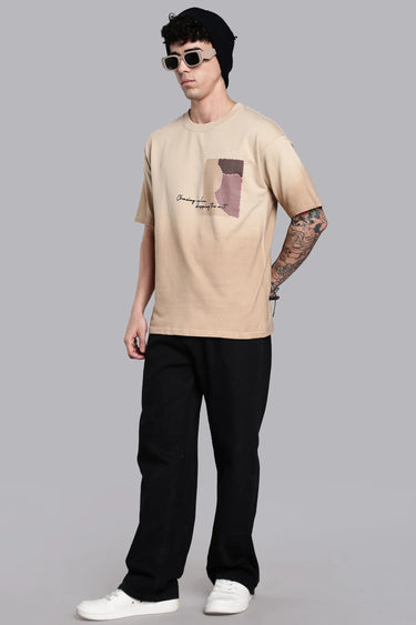 side profile of a man wearing beige scar oversized t-shirt