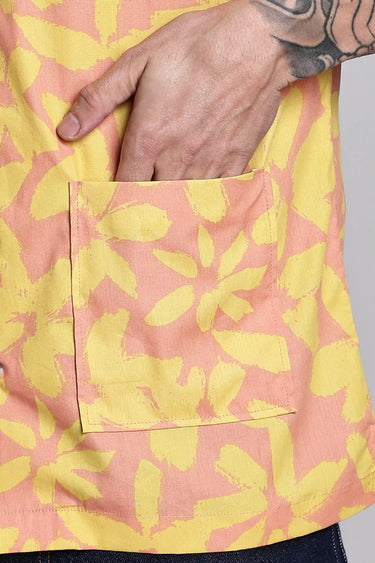 close up of a pocket in red and yellow floral print shirt