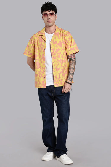 a man layering red and yellow floral print shirt