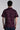 back view of a man wearing purple embroidery shirt
