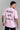 A man wearing a pink P.A.P. unisex oversized t-shirt - backview