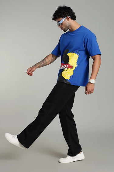 side profile of a man wearing the BLUE DELULU OVERSIZED T-SHIRT