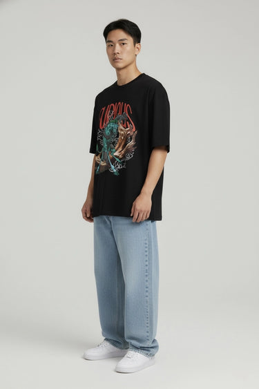 Black oversized graphic t-shirt with fierce tiger and "Furious" text, paired with light blue jeans.