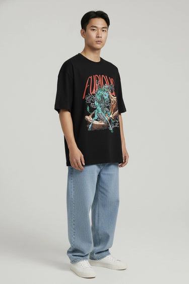 Black oversized graphic t-shirt with vibrant futuristic artwork and red "Furious" text, paired with light blue jeans and.