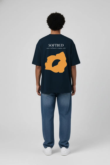 rear view of a man wearing the soft bud petrol blue oversized graphic tee 