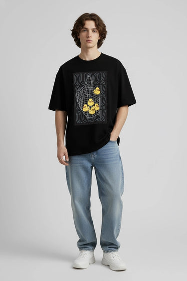 a man wearing the black quack oversized graphic t-shirt 