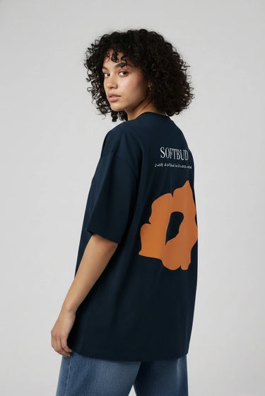 a woman posing with the petrol blue softbud oversized graphic t-shirt 