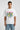 White oversized graphic t-shirt with colorful cartoon insect design and Peepers! text, worn with blue jeans.