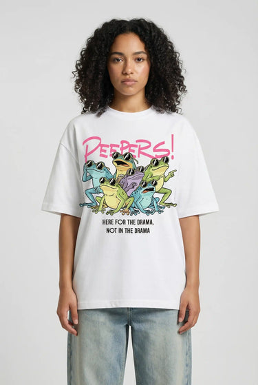 White oversized graphic t-shirt with colorful cartoon design and bold "Peepers!" text, worn with light blue jeans.