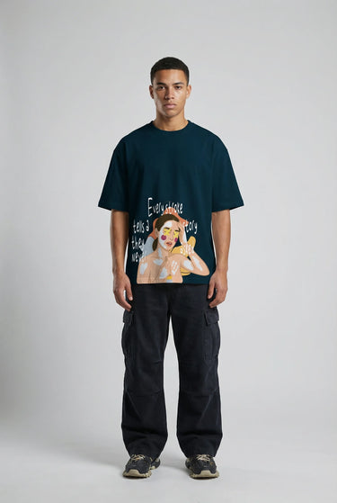 Black oversized graphic t-shirt with colorful cartoon-style face and hand illustration, paired with loose black pants.