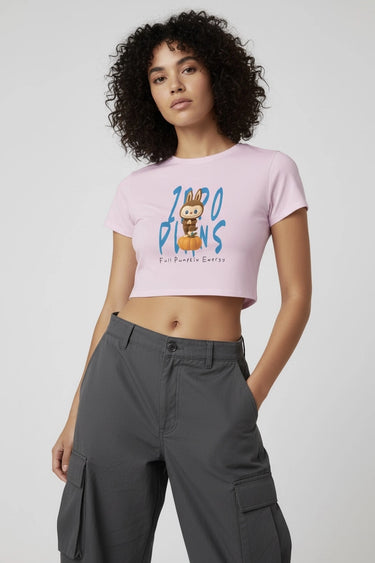 Light pink graphic crop top with colorful monster print and short sleeves. - LYVN
