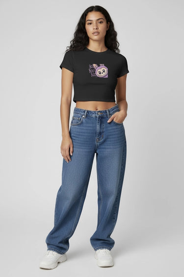 A woman posing with the black monster doll crop top with the graphic that says boo!
