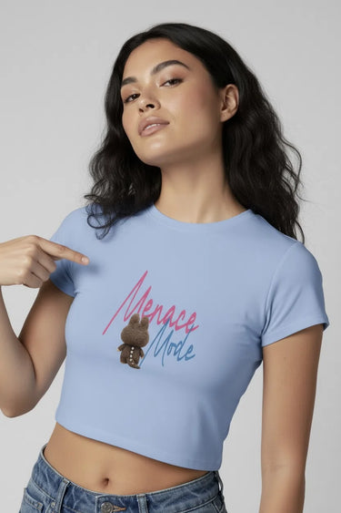 Light blue graphic crop top with "Menace" text and small monster print on chest. - LYVN