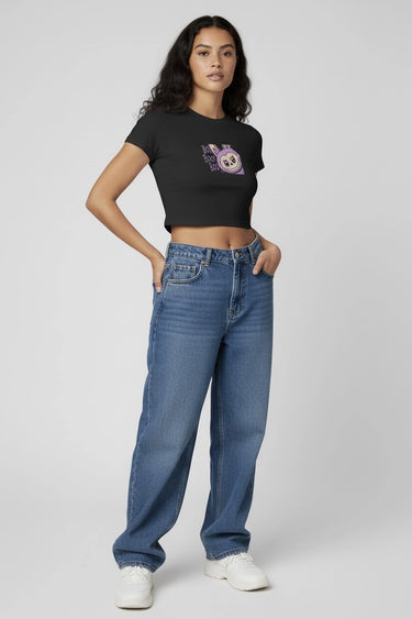 A woman wearing black boo! monster doll graphic crop top