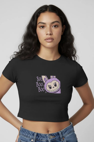 A woman wearing a Black monster doll crop top with the words BOO! BOO! 