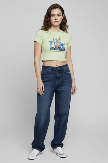 Light green graphic crop top with colorful monster print and short sleeves. - LYVN