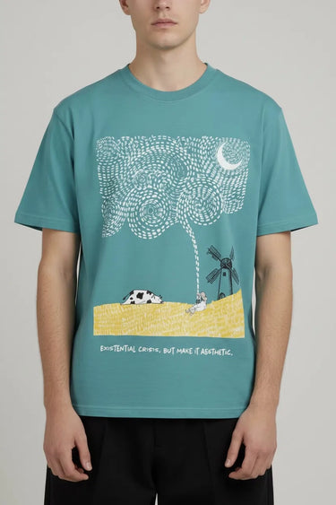 Teal oversized graphic tee with white monster print, crescent moon, and beach scene. - LYVN