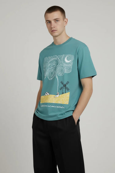 Teal graphic oversized tee on a male model. - LYVN