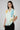 Women's printed shirt with colorful abstract patterns, short sleeves, and a relaxed fit.